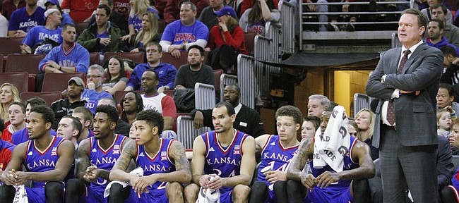 Kansas coach Bill Self and members of the team watch in the closing minutes of a 77-52 loss to the Temple Owls Monday at the Wells Fargo Center in Philadelphia, PA.