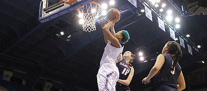 Kansas University senior guard Asia Boyd (0) gets up for two of her 13 points in the Jayhawks' 66-44 victory over Samford on Monday, Dec. 29, 2014, in Allen Fieldhouse.