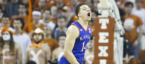 Kansas guard Brannen Greene (14) tries to quiet the Texas crowd after a three during the first half, Saturday, Jan. 24, 2015 at Frank Erwin Center in Austin, Texas.