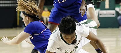 Baylor guard Niya Johnson (2) falls to the ground chasing a loose ball that was stripped away by Kansas' Lauren Aldridge, left, and Chayla Cheadle (22) in the second half of an NCAA college basketball game, Sunday, Feb. 1, 2015, in Waco, Texas. Baylor won 66-58.
