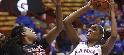 KU forward Chelsea Gardner (15) pulls up for a shot against Texas Tech's Dayo Olabode (32) on Wednesday, Feb. 4, 2015, in Allen Fieldhouse.