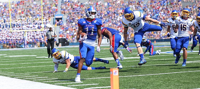 Kansas wide receiver Tre' Parmalee (11) eyes the end zone as he heads in for a touchdown during the second quarter on Saturday, Sept. 5, 2015 at Memorial Stadium.