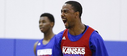 Red Team guard Aaron Miles celebrates a bucket by his team to end the first half of a scrimmage before the basketball campers on Wednesday, June, 19, 2013 at the Horejsi Center.