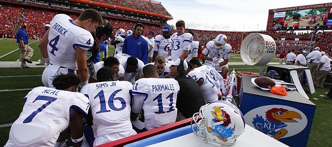 Kansas head coach David Beaty has a sit-down in an attempt to rally the offense just before the fourth quarter on Saturday, Sept. 26, 2015 at High Point Solutions Stadium in Piscataway, New Jersey.