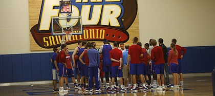 Kansas University coach Bill Self and the Jayhawks gather before practice on Thursday, Oct. 15, 2015, at the KU practice facility.
