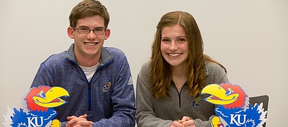 From left, FSHS Cross Country runners Ethan Donley and Claire Sanner both signed letters of intent to KU on Tuesday November 17, 2015.