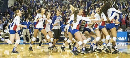 Kansas players rush the court following their three set sweep of Missouri in the second round of the NCAA volleyball tournament Friday evening at the Horejsi Center.
