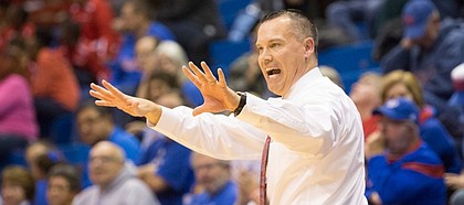 Kansas university coach Brandon Schneider motions to his players during Kansas’ Nov. 19 game against Memphis at Allen Fieldhouse.