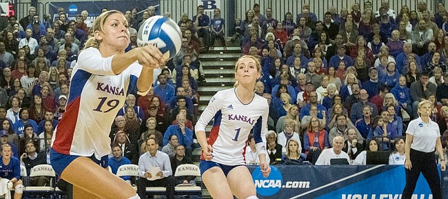 Kansas' Tiana Dockery (7) and Anna Church (1) watch as junior Maggie Anderson (19) keeps the ball in play during Kansas' second round NCAA volleyball tournament match against Missouri on Friday night at the Horejsi Center. The Jayhawks sent the Tigers packing with a three set sweep. 