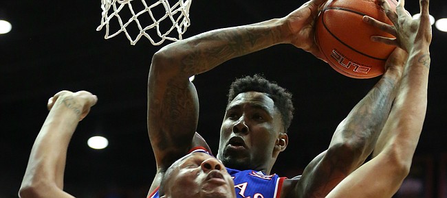 Kansas forward Jamari Traylor rips away a rebound from San Diego State forward Skylar Spencer (0) during the first half, Tuesday, Dec. 22, 2015 at Viejas Arena in San Diego.