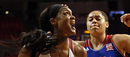 Oklahoma’s Kaylon Williams (42) drives past Kansas’ Tyler Johnson (55) during an NCAA college basketball game on Wednesday, Dec. 30, 2015 in Norman, Oklahoma.