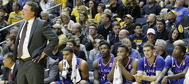 Kansas coach Bill Self and the Jayhawks bench watch the closing minutes of the Jayhawks 74-63 loss to the Mountaineers at the WVU Colliseum in Morgantown, W.V. Tuesday.