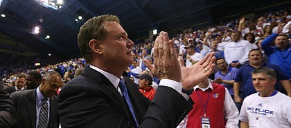 Kansas head coach Bill Self claps as he leaves the court following the Jayhawks' 90-84 win, Saturday, Jan. 30, 2016 at Allen Fieldhouse.