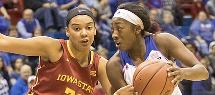 Kansas sophomore Chayla Cheadle, right, looks for a path to the basket around Iowa State's Meredith Burkhall (32) during their game Tuesday evening at Allen Fieldhouse.
