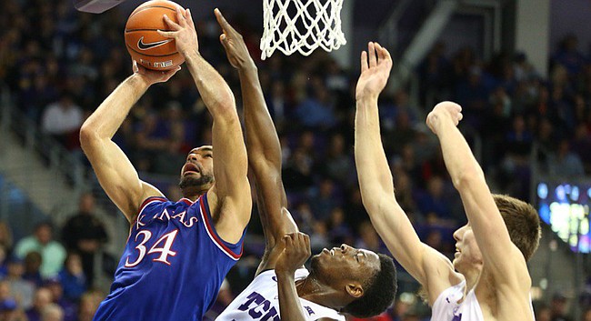 Kansas forward Perry Ellis (34) bangs inside for a bucket against TCU forward JD Miller (15) and forward Vladimir Brodziansky (10) during the second half, Saturday, Feb. 6, 2016 at Schollmaier Arena in Forth Worth, Texas.