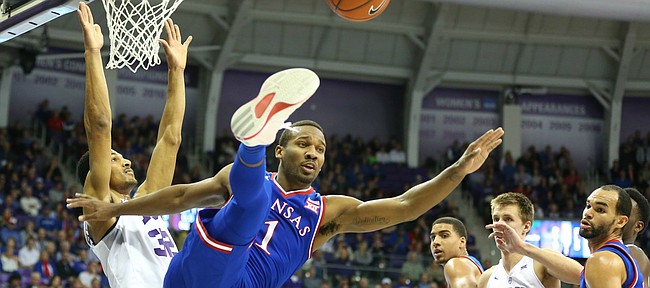 Kansas guard Wayne Selden Jr. (1) and TCU forward Karviar Shepherd (32) get tangled as they fight for a rebound during the first half, Saturday, Feb. 6, 2016 at Schollmaier Arena in Forth Worth, Texas.