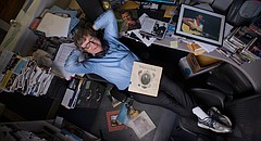 West Side Folk founder and artistic director Bob McWilliams is pictured in his office at the Kansas Public Radio studios. The show is ending its 20-plus year run this month.