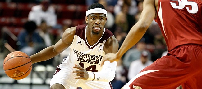 Mississippi State guard Malik Newman (14) dribbles up court past Arkansas forward Keaton Miles (55) in the second half of an NCAA college basketball game in Starkville, Miss., Tuesday, Feb. 9, 2016. Mississippi State won 78-46. (AP Photo/Rogelio V. Solis)
