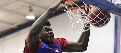 Freshman center Udoka Azubuike delivers a powerful dunk during a KU camp scrimmage on Wednesday, June 15, 2016 at the Horejsi Athletic Center.