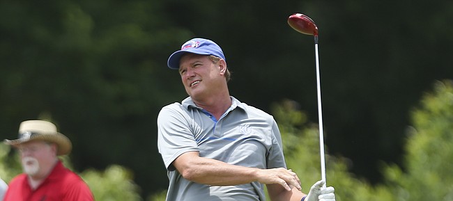 Kansas University basketball coach Bill Self watches his drive from the first hole during the Bill Self/LPRD Golf Classic, Friday, June 17, 2016, at Eagle Bend. Proceeds from the event will benefit the Wee Folk Scholarship fund.