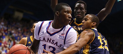 Kansas forward Cheick Diallo (13) looks for an outlet as he is defended by UC Irvine forward Brandon Smith (13) and center Mamadou Ndiaye (34) during the second half, Tuesday, Dec. 29, 2015 at Allen Fieldhouse.