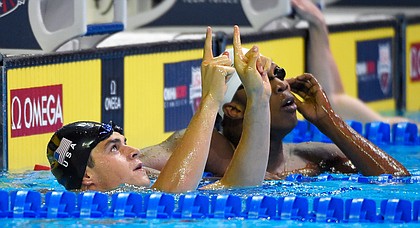 Michael Andrew reacts after winning his preliminary heat in the men's 100-meter breaststroke at the U.S. Olympic swimming trials, Sunday, June 26, 2016, in Omaha, Neb. (AP Photo/Mark J. Terrill)