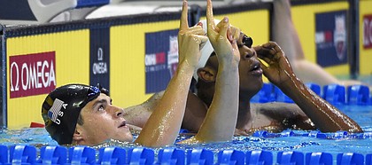 Michael Andrew reacts after winning his preliminary heat in the men's 100-meter breaststroke at the U.S. Olympic swimming trials, Sunday, June 26, 2016, in Omaha, Neb. (AP Photo/Mark J. Terrill)
