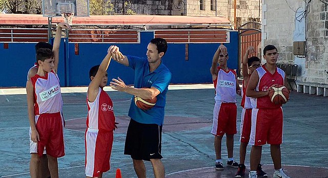Former Kansas Guard Brett Ballard, center, instructs young players in late July as part of the PeacePlayers International initiative in Israel. Ballard, who is an assistant coach at Wake Forest, spent a week helping at coaching clinics in the region.