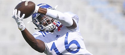 Kansas freshman cornerback Kyle Mayberry pulls in a catch during practice on Friday, Aug. 19, 2016 at Memorial Stadium.