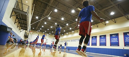 Kansas guard Devonte Graham, right, wields a jump rope with his teammates during Boot Camp in the practice gym on Friday, Sept. 23, 2016 just after 6 a.m.