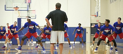 Kansas head coach Bill Self watches as the players rapidly shuffle across the court during Boot Camp in the practice gym on Friday, Sept. 23, 2016 just after 6 a.m.