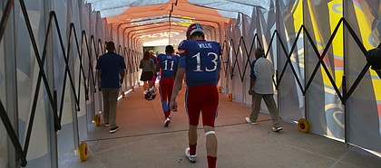 Kansas quarterback Ryan Willis (13) walks through the tunnel to the locker room following the Jayhawks' 24-23 heartbreaking loss to TCU on Saturday, Oct. 8, 2016 at Memorial Stadium.