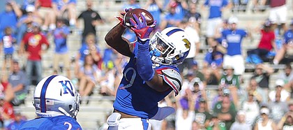 Kansas safety Fish Smithson (9) pulls in an interception in the end zone during the third quarter on Saturday, Sept. 10, 2016 at Memorial Stadium.