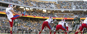 Kansas' Cole Moos (36) punts from the Jayhawks' end zone late in the fourth quarter on Saturday, Oct. 15, 2016 at McLane Stadium in Waco, Texas.