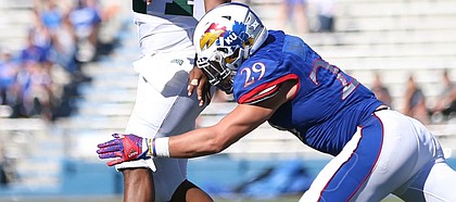 Kansas linebacker Joe Dineen Jr. (29) pressures Ohio quarterback Greg Windham (14) during the third quarter on Saturday, Sept. 10, 2016 at Memorial Stadium.