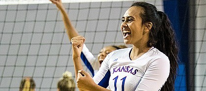 Kansas junior setter Ainise Havili celebrates a point against West Virginia on Thursday, Oct. 20, 2016 at Horejsi Center.