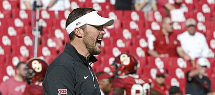 Oklahoma offensive coordinator Lincoln Riley shouts to his players before the start of of an NCAA college football game between Kansas State and Oklahoma in Norman, Okla., Saturday, Oct. 15, 2016. (AP Photo/Sue Ogrocki)