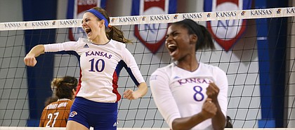 Kansas middle blocker Tayler Soucie (10) and Kansas right side hitter Kelsie Payne (8) celebrate a point during the fifth set on Saturday, Oct. 29, 2016 at the Horejsi Center.
