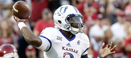 Kansas quarterback Montell Cozart (2) passes against Oklahoma during the first half of an NCAA college football game in Norman, Okla., Saturday, Oct.29, 2016.