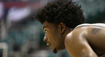 Kansas guard Josh Jackson gets a break on the sidelines as the team works on perimeter defense during a practice on Thursday, Nov. 10, 2016 at Stan Sheriff Center in Honolulu, Hawaii.
