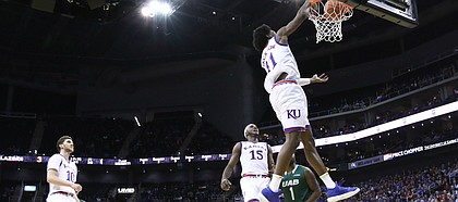 Kansas guard Josh Jackson (11) hammers home a dunk during the first half of the CBE Classic on Monday, Nov. 21, 2016 at Sprint Center.