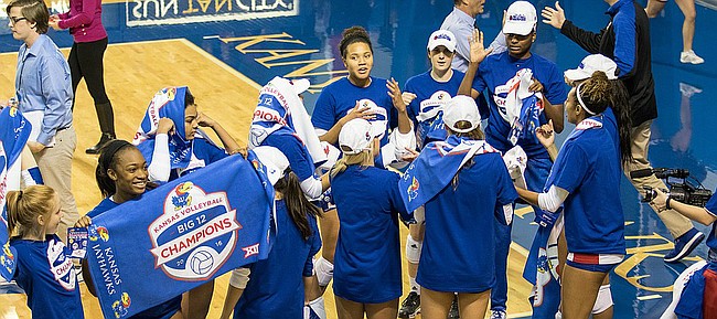 Kansas volleyball players try on their Big 12 Champions hats and shirts after a five-set victory against Iowa State on Saturday, Nov. 19, 2016 at Horejsi Center. The Jayhawks won in five sets, clinching a Big 12 title. 