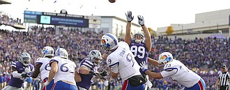 Kansas quarterback Carter Stanley (9) heaves a long pass from the Jayhawks' own end zone during the fourth quarter, Saturday, Nov. 26, 2016 at Bill Snyder Family Stadium.