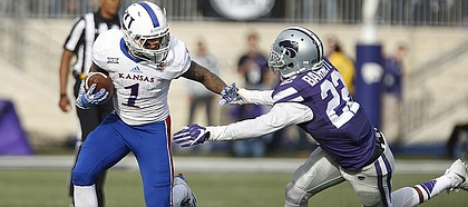 Kansas wide receiver LaQuvionte Gonzalez (1) tries to shake Kansas State defensive back Dante Barnett (22) during the fourth quarter, Saturday, Nov. 26, 2016 at Bill Snyder Family Stadium.
