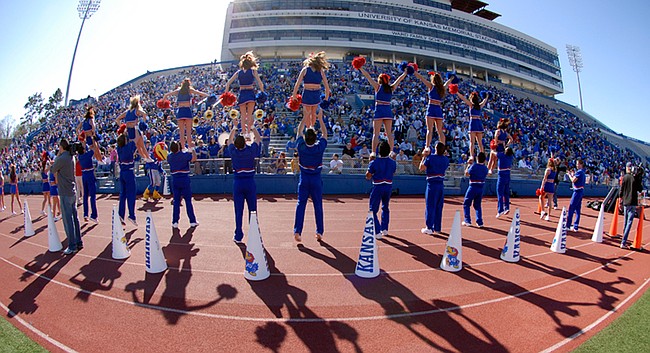 Kansas cheerleaders are hoisted into the air during the spring scrimmage on Sunday, April 15, 2007, at Memorial Stadium.