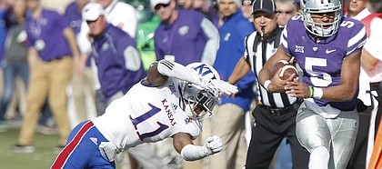 Kansas safety Mike Lee (11) shoves Kansas State quarterback Alex Delton (5) out of bounds on a run during the third quarter, Saturday, Nov. 26, 2016 at Bill Snyder Family Stadium.