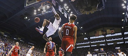 Kansas guard Josh Jackson (11) dunks off of a lob against Nebraska during the second half, Saturday, Dec. 10, 2016 at Allen Fieldhouse.