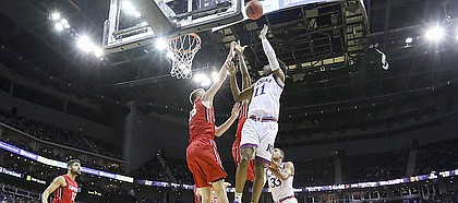 Kansas guard Josh Jackson (11) gets inside for a bucket against Davidson during the second half, Saturday, Dec. 17, 2016 at Sprint Center.
