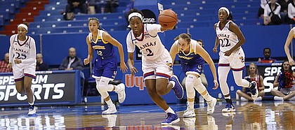 Kansas guard McKenzie Calvert (2) starts a fast break after a steal in the Jayhawks overtime UC Riverside at Allen Fieldhouse Wednesday, Dec. 21.