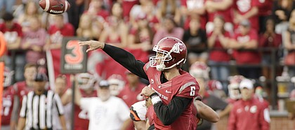 FILE — Washington State quarterback Peyton Bender (6) throws the ball during the second half of an NCAA college football game against Oregon State, Saturday, Oct. 17, 2015, in Pullman, Wash. Bender signed with Kansas in December 2016, as a junior college transfer from Itawamba Community College. (AP Photo/Young Kwak)